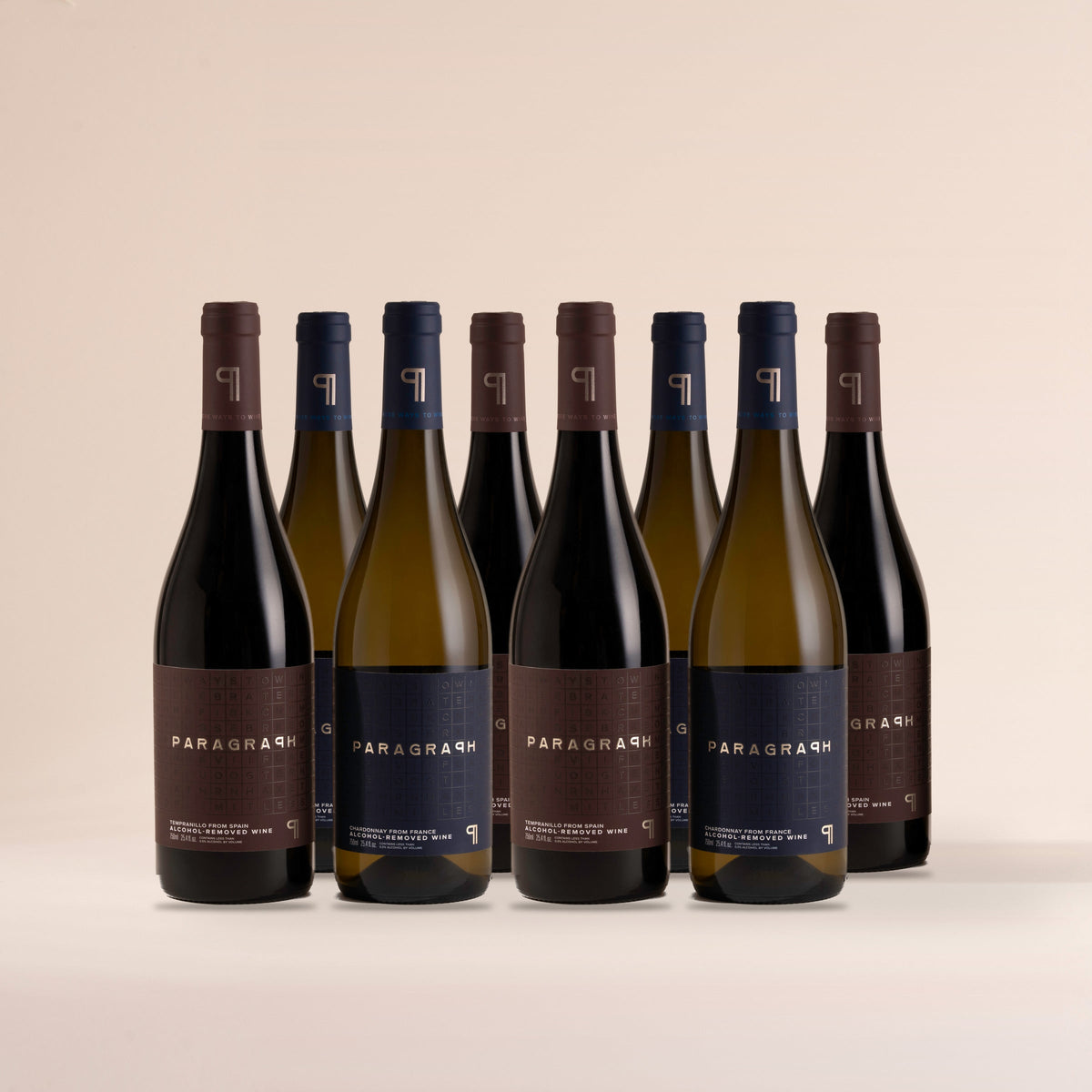Six bottles of PARAGRAPH Tempranillo and six bottles of PARAGRAPH Chardonnay, standing on cream