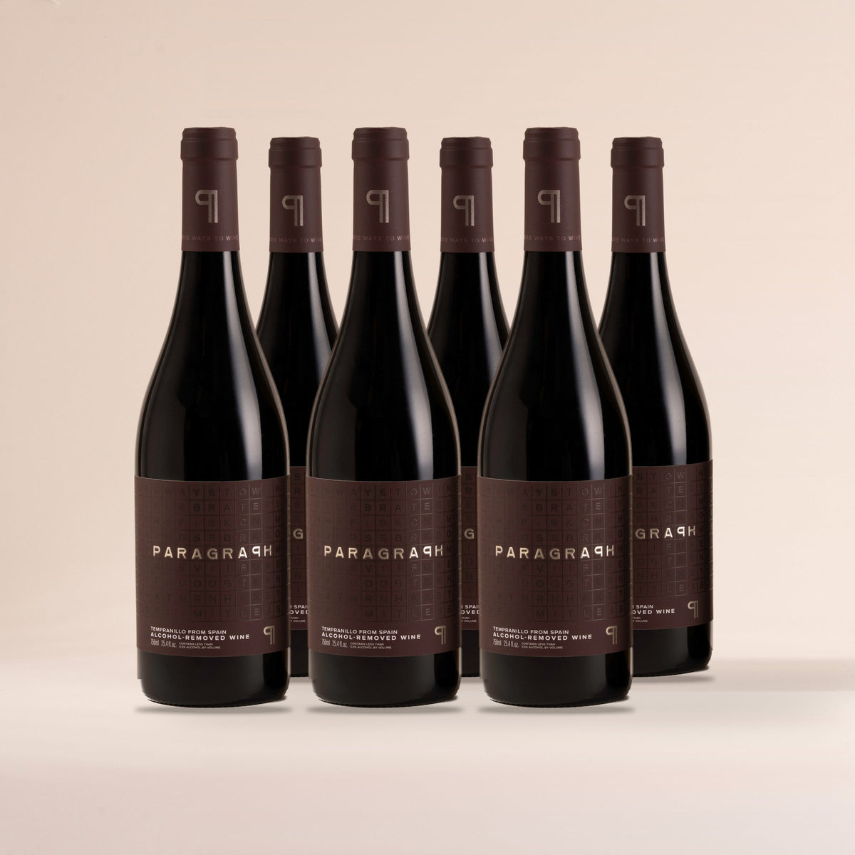 Six bottles of PARAGRAPH Tempranillo, standing on cream