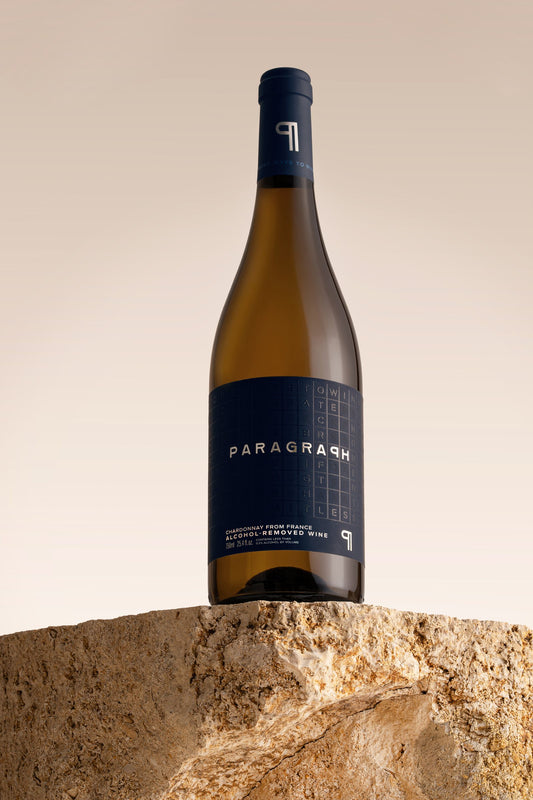 PARAGRAPH Chardonnay bottle standing on a stone block